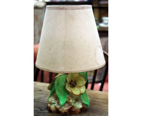 A FLOSMARON POTTERY TABLE LAMP in the form of orange rimmed flowers on a rocky outcrop, 15cm high not including shade