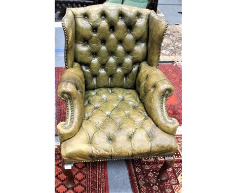 AN ANTIQUE GREEN LEATHER BUTTON UPHOLSTERED SMALL SIZED WING BACK ARMCHAIR 74cm wide x 69cm deep x 92cm high