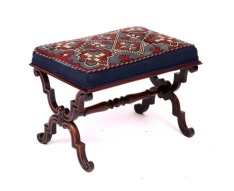 A VICTORIAN ROSEWOOD FRAMED FOOT STOOL with a tapestry upholstered seat, turned scrolling ends united by a turned stretcher, 