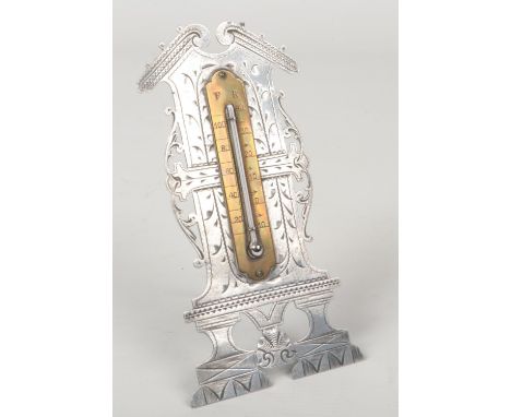A Georgian steel and brass mounted mercury thermometer on strut stand. With open triangular pediment, scrollwork mantling  an