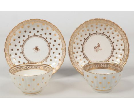A pair of Caughley fluted teabowls and saucers. Decorated in gilt with the Polka Dot pattern c.1790, saucers 14cm wide.  Some