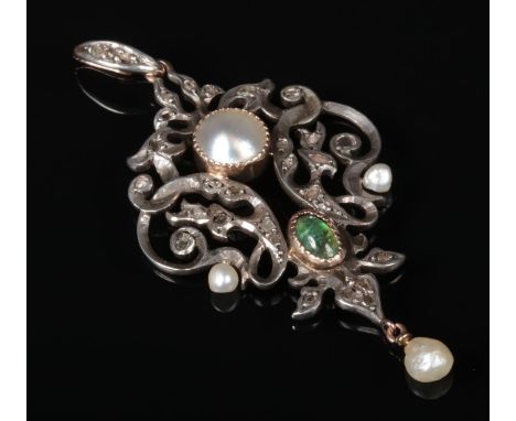 A 19th century gold and silver openwork pendant, bale and drop. Set with rough cut diamonds, a cabochon emerald and mabe pear