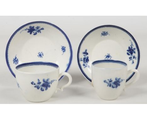 A Caughley teacup and coffee cup, both with saucers. The teacup with unusual reeded ear shaped handle. Both painted in underg