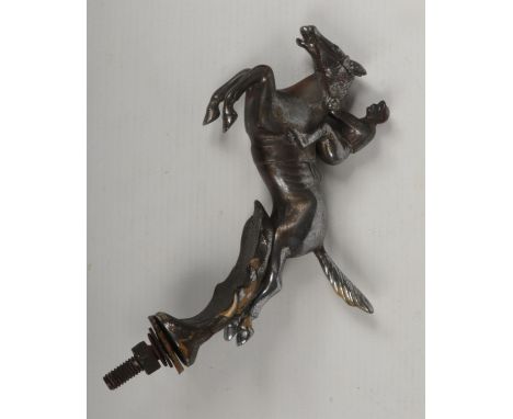 A vintage Desmo chromium plated horse and jockey car mascot, 18cm including nut.  Tarnished and pitted.