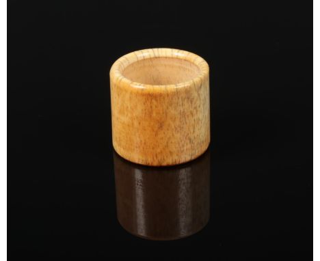 A 19th century Chinese carved bone archers ring, 29mm, 32mm diameter.  Natural hair cracking.