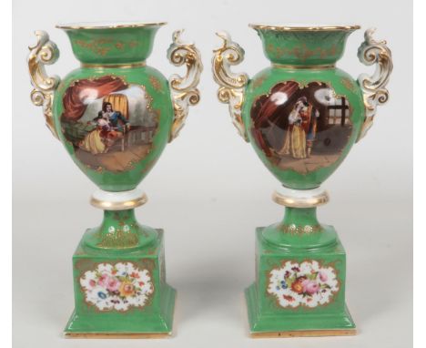 A pair of 19th century Paris porcelain pedestal mantel vases. Green ground, with twin scrolling handles, raised gilding and p