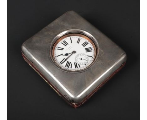An Edwardian colonial silver mounted watch stand housing a Swiss goliath watch. Silver and dial signed Hamilton &amp; Co. Cal