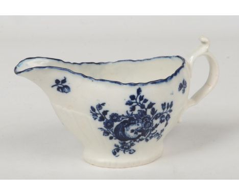 A Caughley sauceboat of rare shape with scalloped rim and partially strap fluted. Printed in underglaze blue with the Sliced 