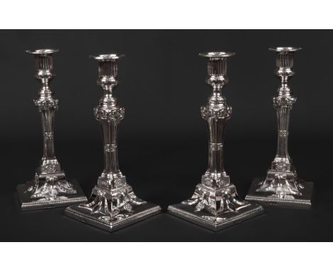 A fine set of four George III silver table candlesticks by John Cafe in later fitted case. Weighted and modelled in Neo-Class