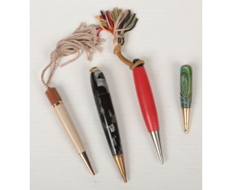 Four vintage dance pencils, two with marbleised cases.  