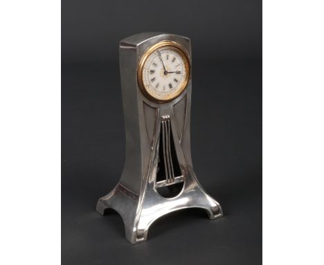 A Continental Art Nouveau silver cased desk clock. With enamel dial, pierced and stamped 935, silver 82 grams, 11.25cm.  Bala