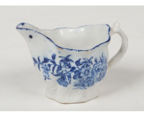 A Caughley low Chelsea ewer. Painted in underglaze blue with flowers and insects c.1780, 6.5cm.  Good condition. No damage or