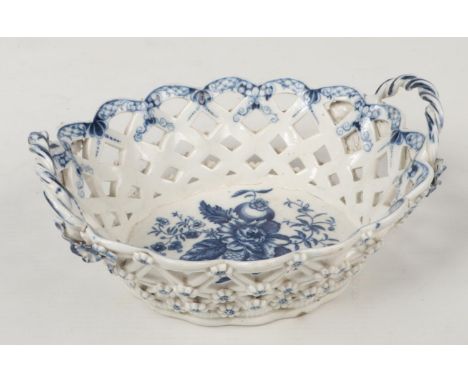 A Caughley chestnut basket with a pair of twist handles, applied flowerheads and printed in underglaze blue with the Pinecone