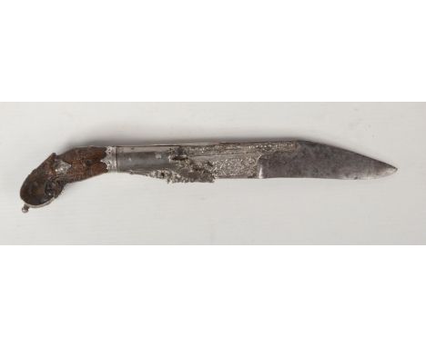 A 19th century Ceylon dagger, silver mounted and with carved horn scales, 28cm.  Pitting to the blade. Some movement in the s