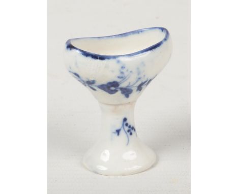 A rare Caughley eye bath of pedestal form. Painted in underglaze blue with trailing sprigs c.1780, 5.25cm.  Cracked with some