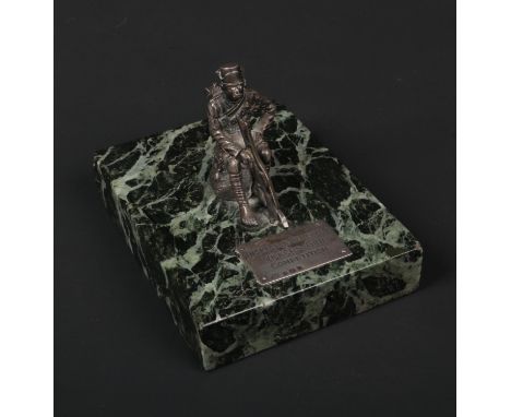 A silver and verde antico marble military trophy, Inspector Generals, Vickers Gun Competition. Surmounted with a seated figur