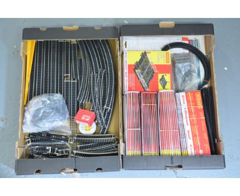 A good quantity of mostly unused OO gauge model railway track; two trays mostly Hornby trains, including still in packets R80