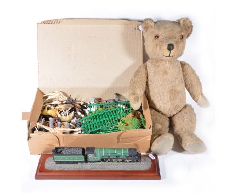 Plastic zoo animals; one tub including Britains and others, and a model of the Flying Scotsman, and a plush teddy bear.