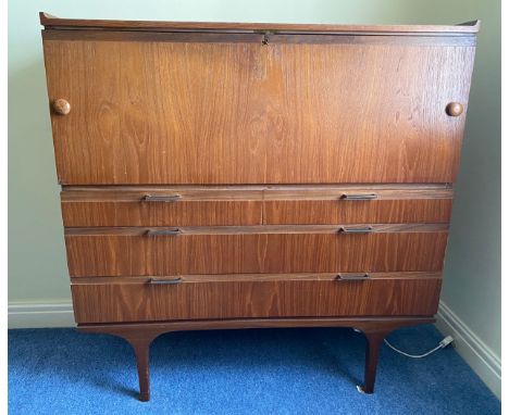 A Merridew teak desk with 2 short over 2 long drawers. 111cms h x 119.5cms w x 45cms d.Condition ReportWear marks to surface.