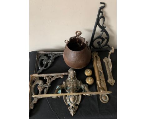 A selection of metal ware to include a decorative brass towel rail, cast iron brackets, brass door handle, brass light switch