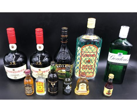 A selection of bottled spirits to include 1 litre Gordon's Gin, 1 x 70cl Gordon's gin, 1 x70cl Baileys, 2 x 70cl Courvoisier 