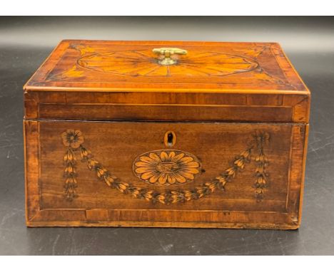 A late 18thC Sheraton mahogany tea caddy, finely inlaid with garland and floral panels with an oval fan inlay to lid with bra