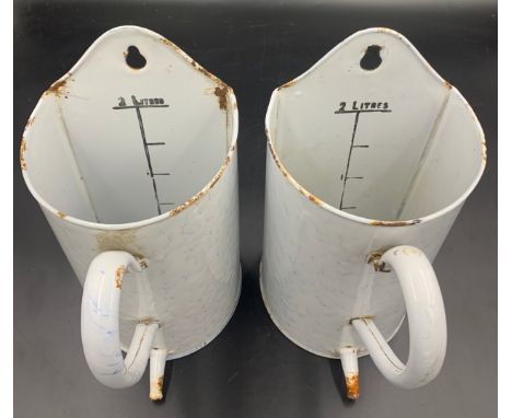 Two vintage 2 litre French marbled enamel wall hanging enema douche jugs. 26cms h.Condition ReportSlight wear to places to th