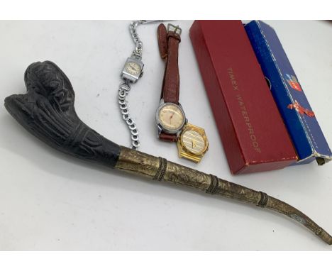 Three lady's wristwatches, Bentina, Porsche and Rotary together with a metal and ceramic pipe.Condition ReportWatches not tes