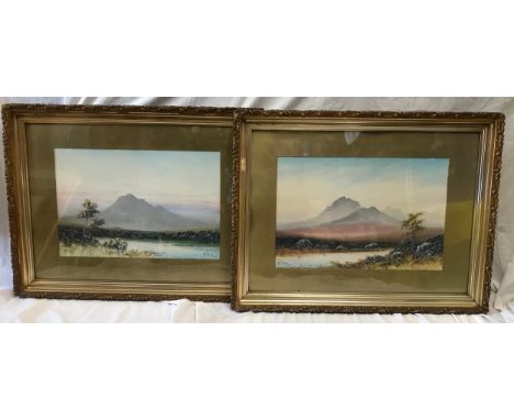 A pair of gilt framed water colours by R J Pollard 1915 of mountain lake scenes.Pictures 32.5cms x 49cms. Frames 57cms x 75cm