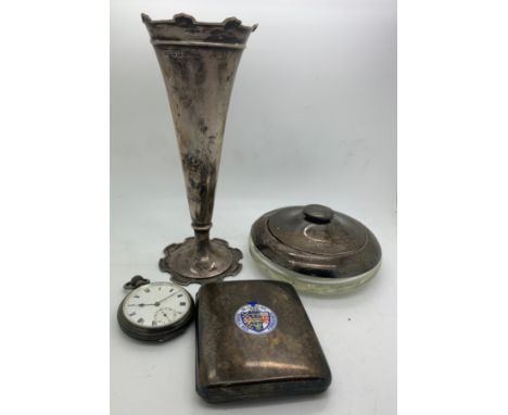 Silver to include a pocket watch Birmingham 1919, vase Birmingham 1914, a dressing table dish London 1928 and an enamel cigar