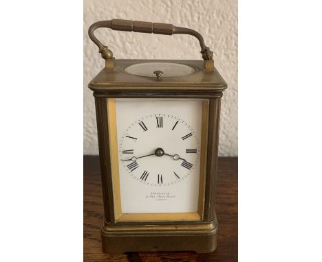 A brass cased carriage clock by J. W. Benson 11.5cms h. Serial number 18268.Cond: Handle bent, some discolouration to gilt. O