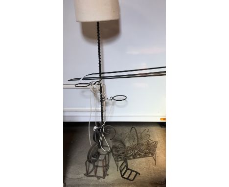 A wrought metal standard lamp 150cms h, wrought metal magazine rack 40cms h x 44cms w and 2 metal brackets. One 29 w x 28 h x