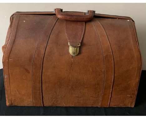 A vintage leather suitcase 47cms w x 37cms l.Condition ReportSome wear and marks to leather.