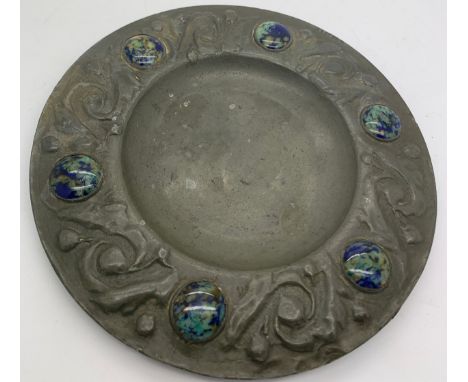 An Arts and Crafts pewter plate with ceramic cabouchons to the border. 15.5cms d.Condition ReportSlight marks to surface.