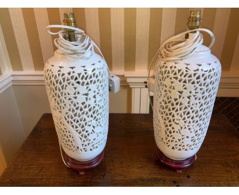 Pair of white ceramic table lamps. 45cms h.Condition ReportGood condition
