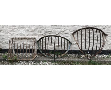 Vintage metal hay racks, largest 96cms x 60cms.Condition ReportSolid, with rust.