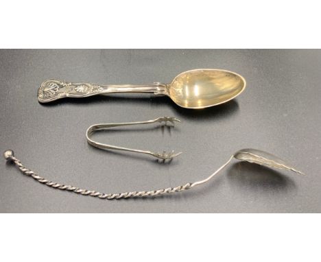 A hallmarked silver spoon London 1854 maker Henry Holland, sugar nips Birmingham 1909 maker I.S. Greenberg &amp; Co and a whi