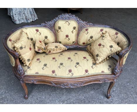 A carved walnut framed two seater sofa, floral upholstered with matching cushions. Height to seat approx. 42cms, height to ba