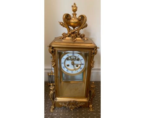 A French visible escapement clock with a mercury pendulum in brass and glass face with key. 44.5cms h.Condition ReportLoose f