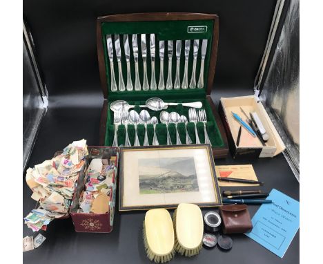 A mixed lot to include an Oneida canteen of cutlery, loose unused stamps, print Houghton Tower, ivory hair brushes, selection