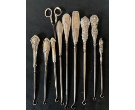 Nine hallmarked silver button hooks, various dates and makers and silver handled scissors, Birmingham 1909.Condition ReportSo
