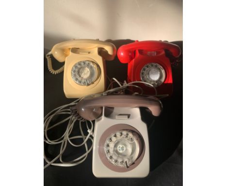 Three vintage telephones, red, cream and brown.Condition ReportNot tested.