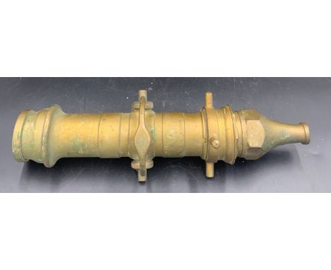 A vintage brass fireman's hose, approx 42cms l.