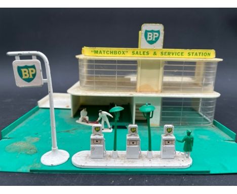 BP Matchbox Garage by Lesney, with additional larger scale petrol pumps, Matchbox service ramp and Blue Box traffic signs sea