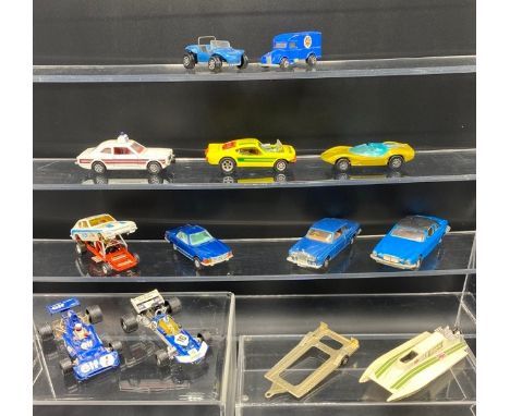 11 Corgi including Whizzwheels and speedboat on trailer(1300g). Condition Report: - Vehicles - Fair