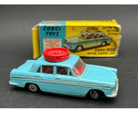 Four boxed Corgi vehicles(450g)Corgi 236 Motor School Car Austin A60 Deluxe saloon, few chips, showing some dust Good in Fair