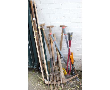A group of garden tools, comprising rakes, hoes, spades, shearers, etc. (a quantity) 