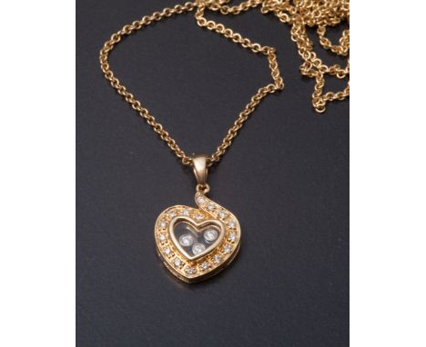18ct yellow gold and diamond set heart shape pendant, set with floating diamonds in the Chopard style, on an 18ct yellow gold