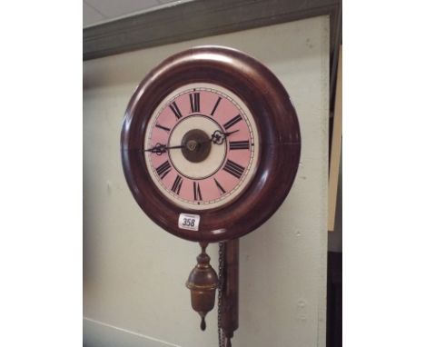 French postman's style circular wall clock with pink and white enamel dial, overall 11" diameter 