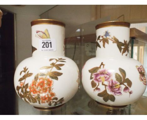 Pair of Royal Worcester vases painted with flowers on ivory ground approximately 17cm tall - slight chip on one rim